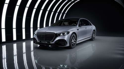 A luxury 2026 Mercedes-Benz S 580 e 4MATIC AMG line sedan captured in a dark, cinematic... wallpaper