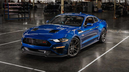 A high-performance blue Ford Mustang automobile. wallpaper