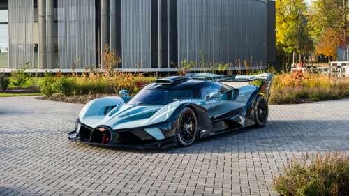 A high-performance Bugatti Bolide hypercar positioned outdoors, emphasizing its aerodynamic... wallpaper photo gallery download