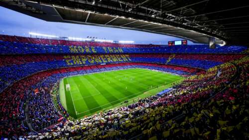 An expansive view of the Camp Nou football stadium in Barcelona, Spain, the legendary... wallpaper
