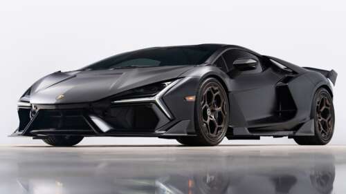 A close-up, high-detail view of a Lamborghini Revuelto featuring a premium carbon... hd background