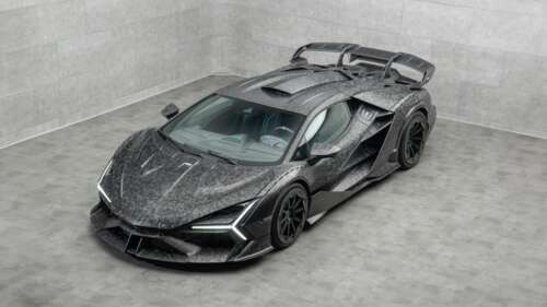 A detailed 5K close-up of a Lamborghini Revuelto featuring an exquisite carbon fiber... free wallpaper