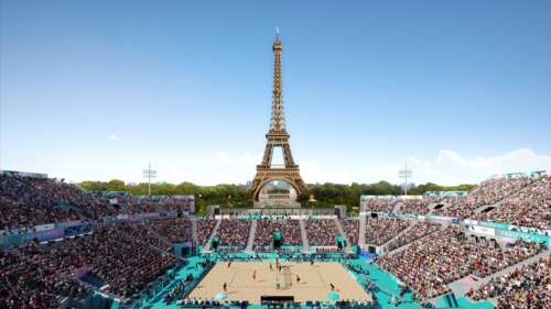 A volleyball player in mid-action during a match at the Paris 2024 Olympics with... wallpaper download