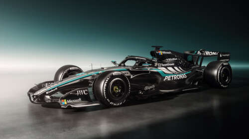 Next-generation 2026 Formula One racing cars speeding through a high-speed circuit. free background images
