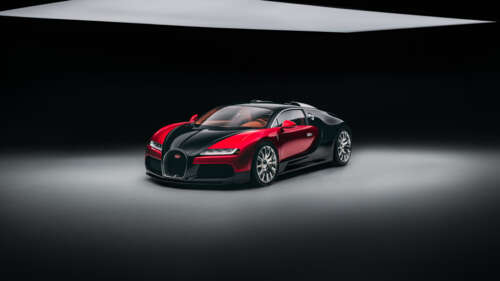 A sleek and futuristic 2026 Bugatti Veyron hypercar prototype positioned against...