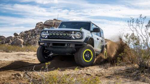A highly detailed, futuristic 2027 off-road SUV designed for rugged landscapes and... free background
