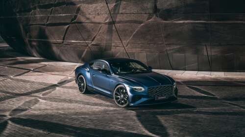 A sleek and futuristic Bentley Continental GT featuring advanced LED lighting and... free wallpaper