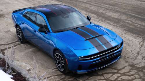 A sleek, metallic blue futuristic car with aerodynamic design and a modern aesthetic. desktop wallpaper