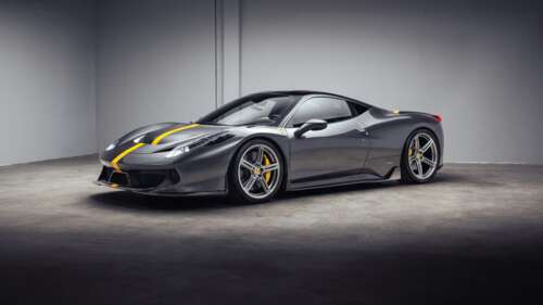 A high-resolution close-up of a Ferrari 458 supercar featuring a sleek, futuristic... hd background