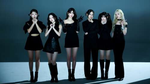 Members of the K-pop group IVE wearing stylish black dresses. wallpaper