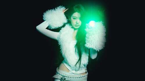 Cinematic portrait of K-pop star Jang Wonyoung from IVE against a dark background wallpaper download