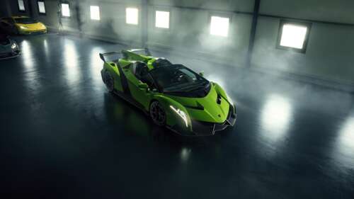 A vibrant green Lamborghini Veneno Roadster parked in a modern, high-end garage. wallpaper