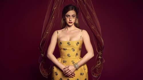 A high-resolution, cinematic portrait of Lili Reinhart against a vibrant red background,...