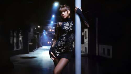 A glamorous portrait of Lisa from Blackpink wearing a stylish black dress at night. computer backgrounds