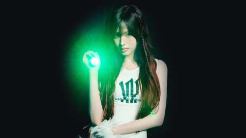 A high-detail, cinematic portrait of Liz from the K-pop group IVE against a dark,... wallpaper download