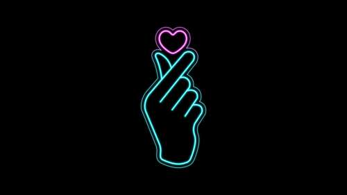 A glowing pink finger heart icon set against a pitch-black background with a soft... high definition wallpaper