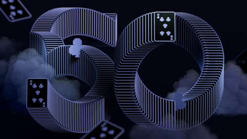 A dark mode aesthetic arrangement of Solitaire playing cards celebrating the 50th... free wallpaper