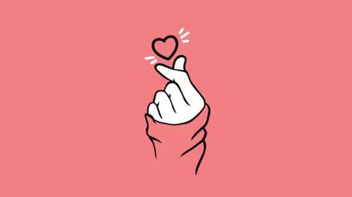 A hand making a finger heart gesture against a soft pastel pink minimalist background. background images hd