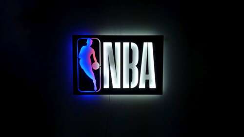 A glowing neon basketball logo with NBA branding on a dark background. wallpaper
