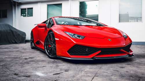 A detailed view of a red Lamborghini Huracan with Vorsteiner performance parts and... pictures for wallpaper
