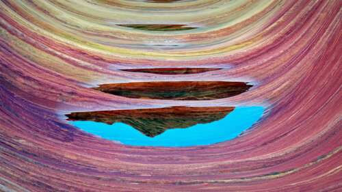 Intricate, colorful swirling sandstone rock formations of The Wave in Coyote Buttes,... free wallpaper