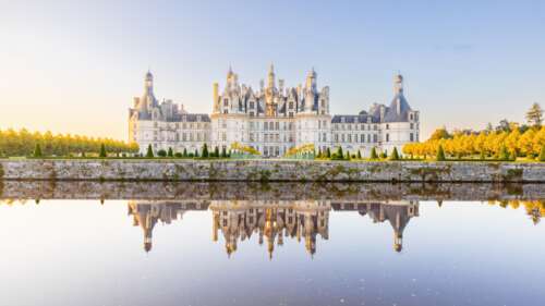 Detailed ancient stone architecture in France with daylight reflections wallpaper download
