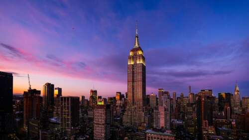 The illuminated Empire State Building standing tall against a twilight New York City... wallpaper photo gallery download