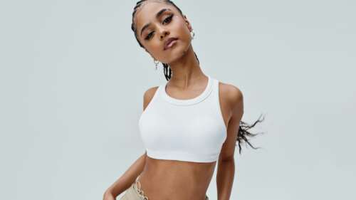 A glamorous, high-detail portrait of singer Tyla in high-fashion attire. wallpaper