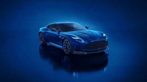 A high-resolution shot of a blue 2025 Aston Martin DB12 S luxury super tourer with... free wallpaper