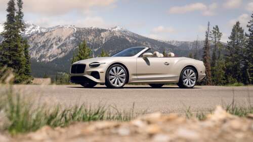 A highly detailed, cinematic view of a luxury 2025 Bentley Continental GT Convertible. free background