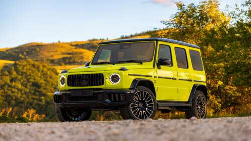 A sleek and powerful 2025 Mercedes-AMG G 63 G-Wagon in a professional studio setting. wallpaper photo gallery download