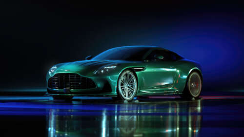 A sleek green Aston Martin DB12 sports car featuring elegant light reflections on... wallpaper download