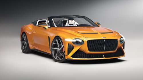 A stunning orange Bentley Mulliner Bacalar luxury convertible parked in a scenic... free wallpaper