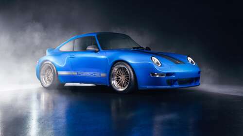 A high-resolution, close-up shot of a classic blue Porsche 911 sports car. wallpaper