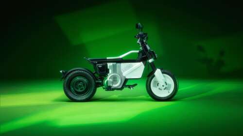A high-resolution 5K concept of a futuristic electric bike with glowing green lights... wallpaper