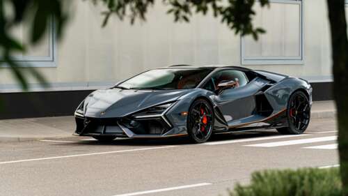 High-resolution close-up of a Lamborghini Revuelto hybrid sports car parked outdoors. background images hd