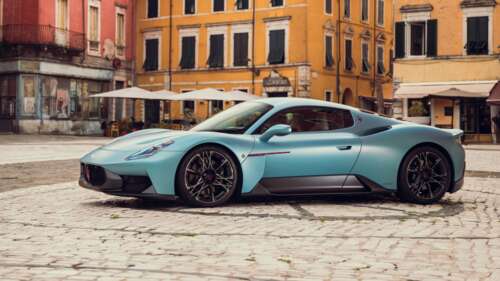 A futuristic Maserati MCPURA 2025 supercar parked in a scenic outdoor environment. wallpaper
