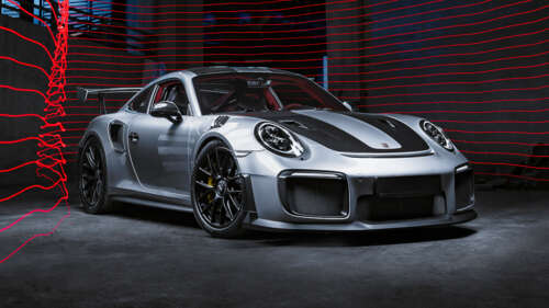 A detailed view of a high-performance Porsche 911 GT2 RS sports car equipped with... wallpaper download