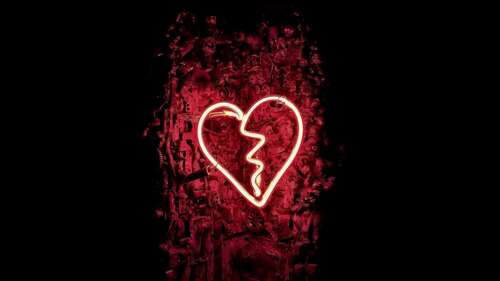 A glowing, shattered dark red neon heart sign against a dark background, symbolizing... wallpaper for pc download