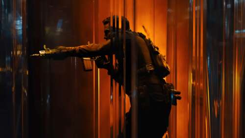 Silhouette of a tactical soldier in full combat gear holding a rifle against bright... free hd wallpapers