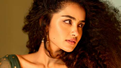A high-detail vertical 5K portrait of Indian actress Anupama Parameswaran. wallpaper for laptop download