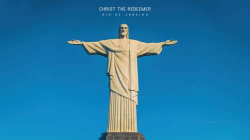 The Christ the Redeemer statue in Rio de Janeiro, Brazil, under a sunny blue sky. free wallpaper