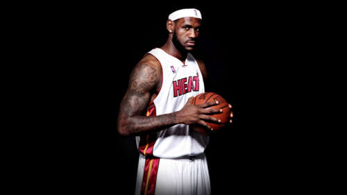 LeBron James in a Miami Heat basketball uniform against a solid black background wallpaper