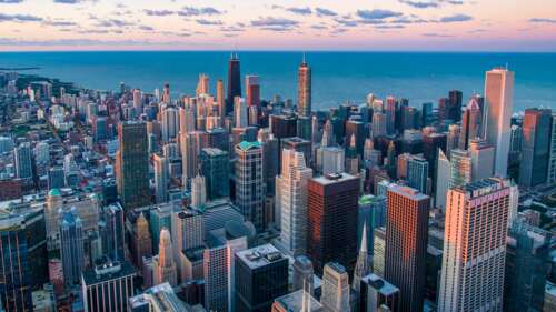 Aerial view of the Chicago skyline featuring towering skyscrapers and urban cityscape. wallpaper