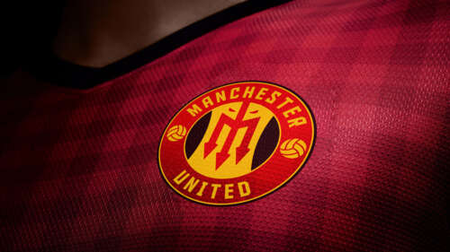 Close-up of the Manchester United red football jersey featuring the official club... wallpaper