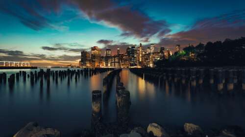 New York City skyline at sunset with vibrant twilight sky and glowing city lights free wallpaper