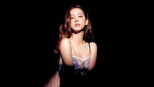 A high-contrast portrait of a K-pop idol with luminous, colorful lighting against... free background images