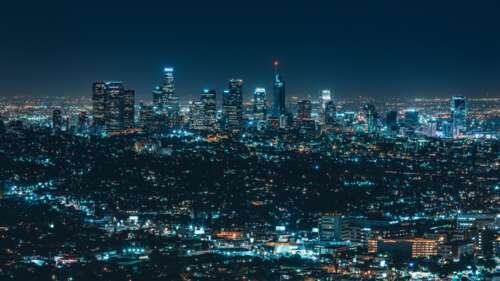 A luminous night view of the Los Angeles skyline with brightly lit skyscrapers and... wallpaper for pc download