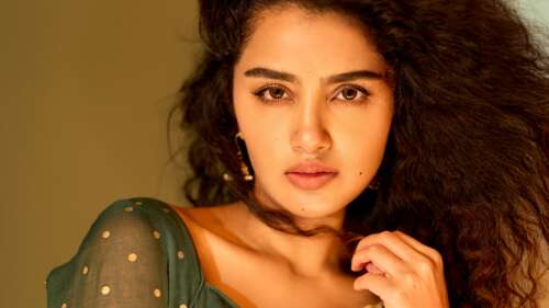 A high-detail portrait of Indian actress Anupama Parameswaran featuring her expressive... free background images