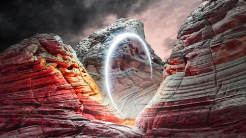 A glowing circular light illuminating the rocky walls of a canyon during a dramatic... wallpaper